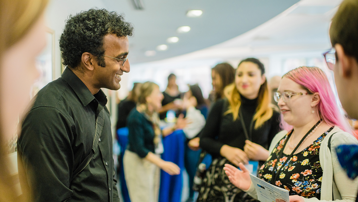 Following his keynote, Anand Varma joined the networking session upstairs. Here, he&#039;s speaking with SUNY-ESF student and Storyfest finalist, Janet Rogers.