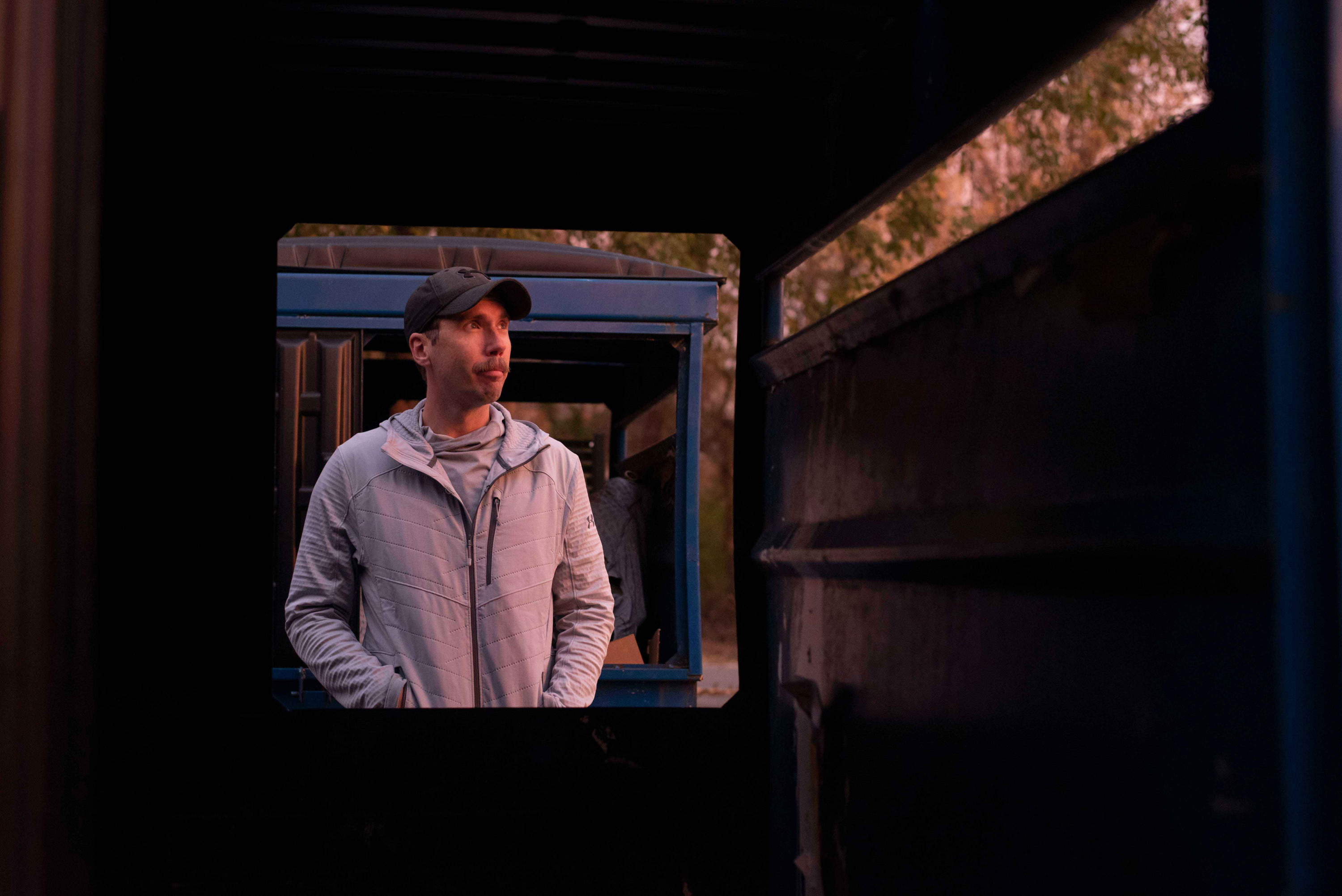 Joseph Wright poses for a portrait after dropping off his pickings at recycling dumpsters.