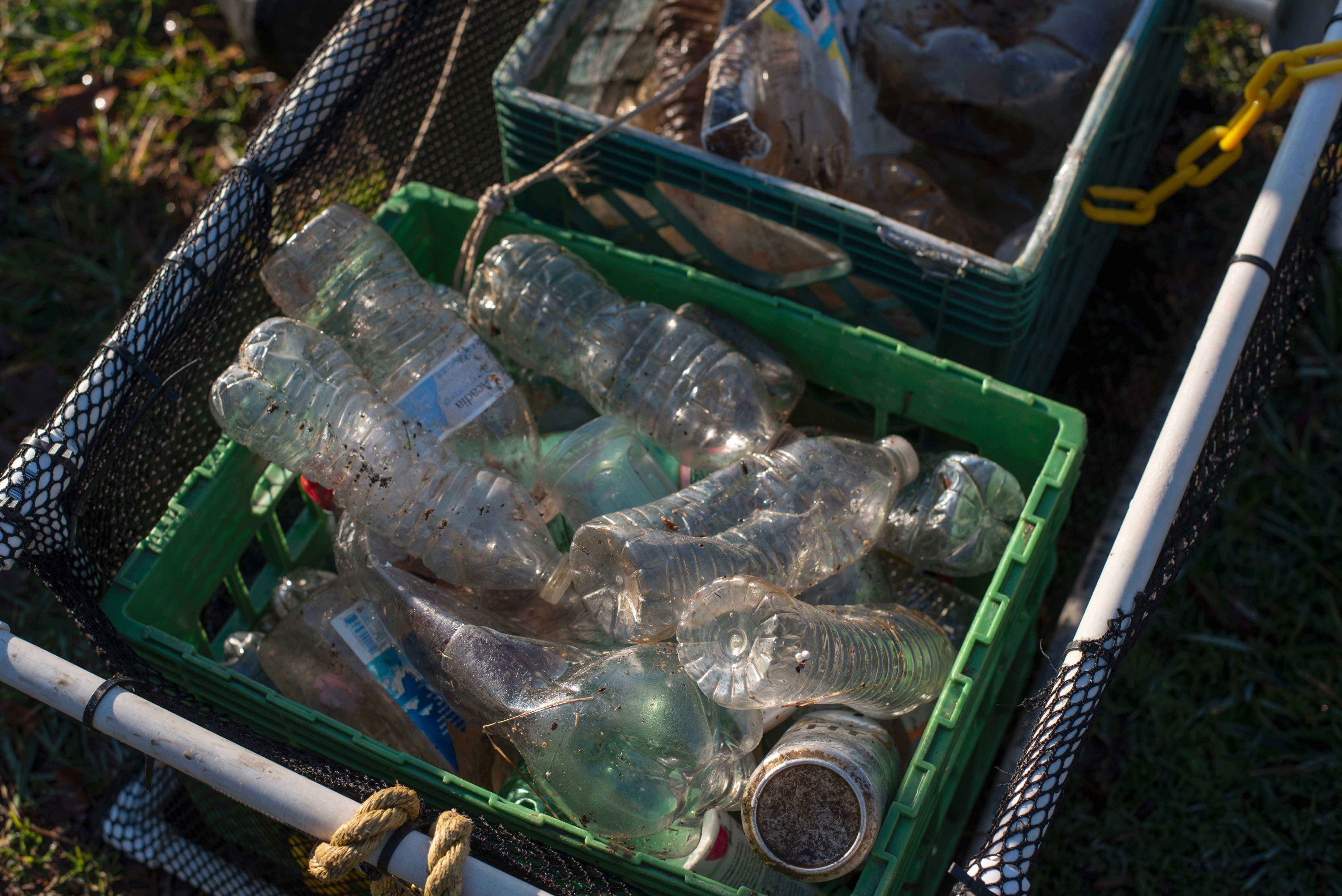 Plastic water bottles are seen in Joseph&#039;s cart following a picking session on January 26 2020.