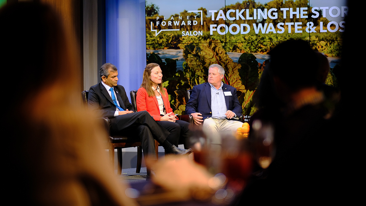 Vimlendra Sharan and Chip Bowling are joined on stage with Meghan Chapple, Director of GW&#039;s Office of Sustainability.