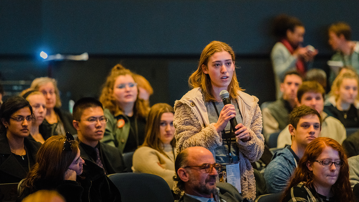 An audience member asks The New York Times Climate Editor, Hannah Fairfield, a question after her presentation.