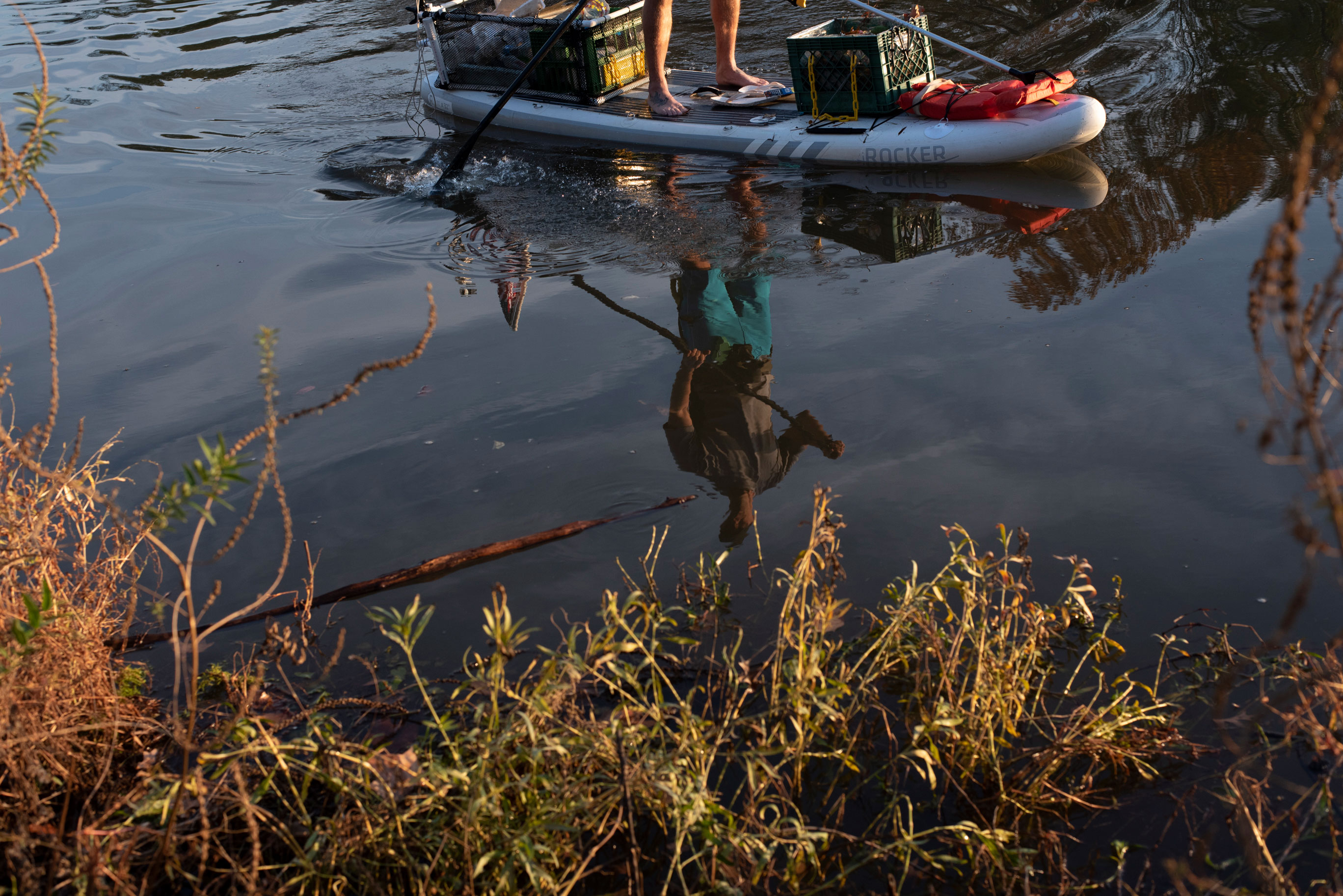 Joseph Wright&#039;s reflection is seen on the Potomac River in Alexandria, VA on November 5, 2019.