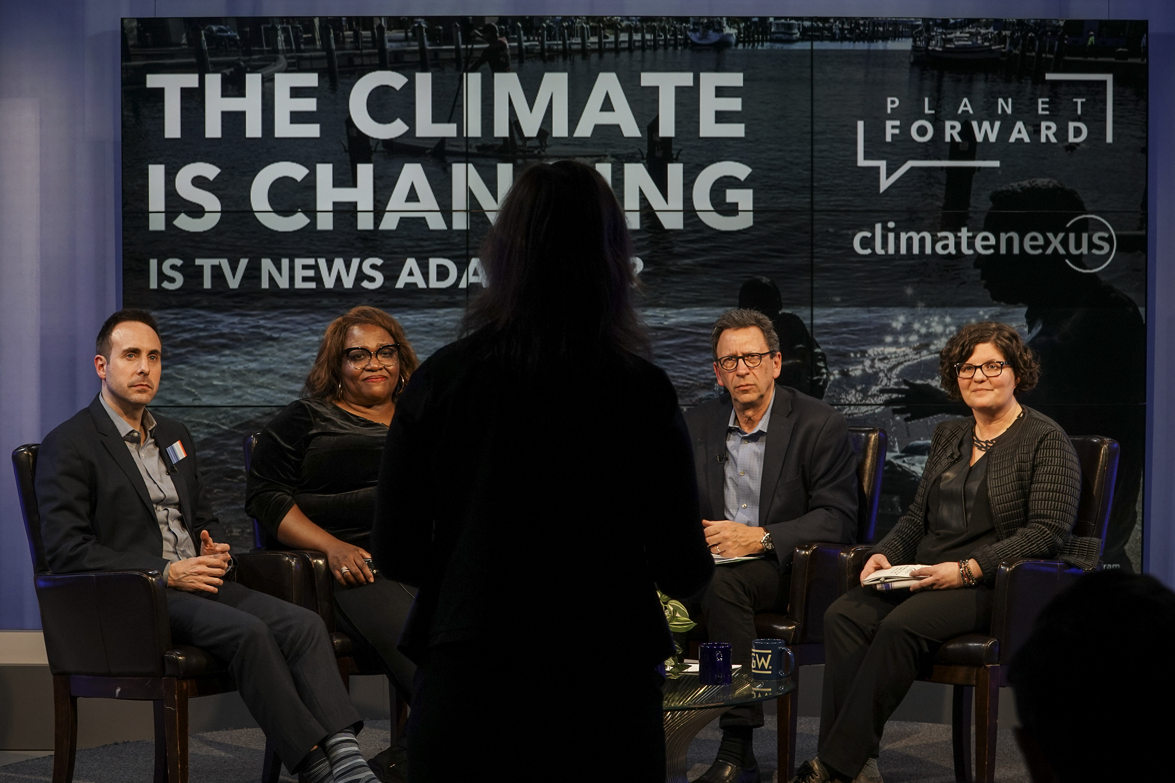 Lisa Palmer, GW&#039;s National Geographic visiting professor for science communication, asks a question to the panel, from left: Jeff Berardelli from CBS News, Eugenia Harvey from WNET, Planet Forward founder Frank Sesno, and CNN&#039;s Jen Christensen at the event co-hosted by Planet Forward and Climate Nexus. (Photos by PlanetForward.org)