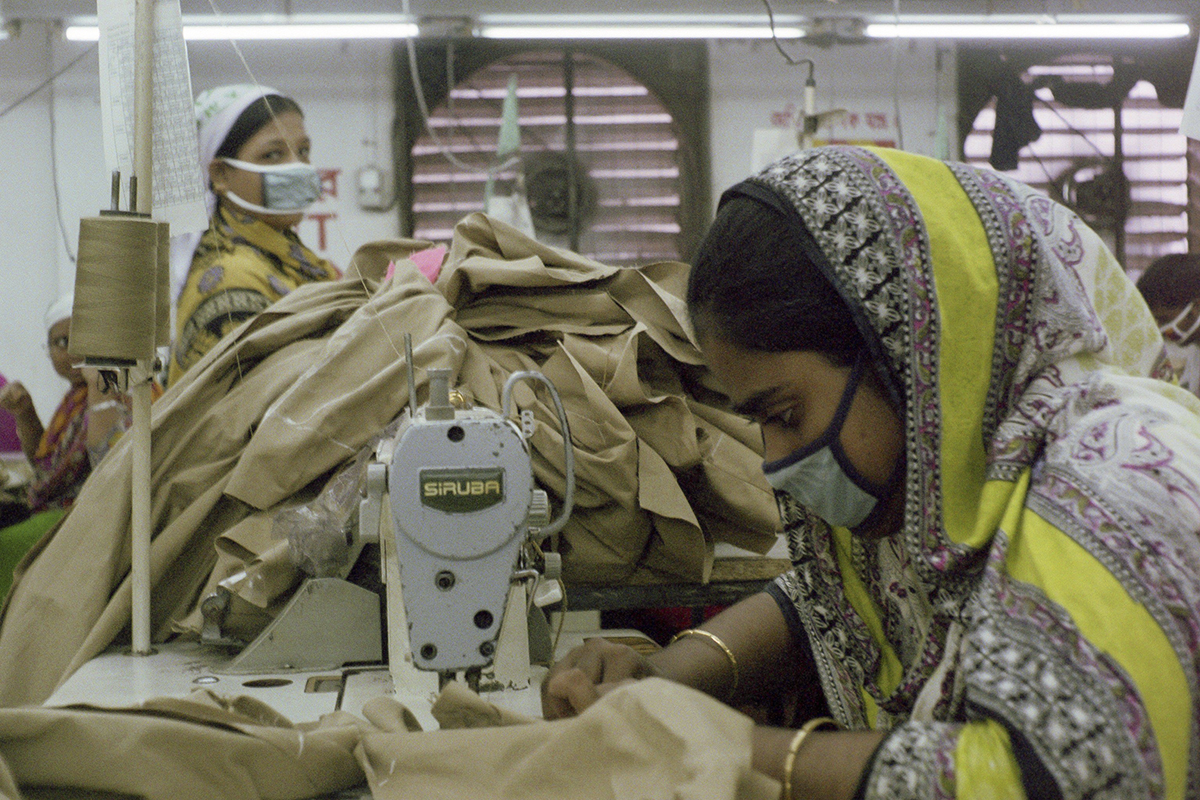 Garment workers sewing khaki pants in the Intramex Group Factory.