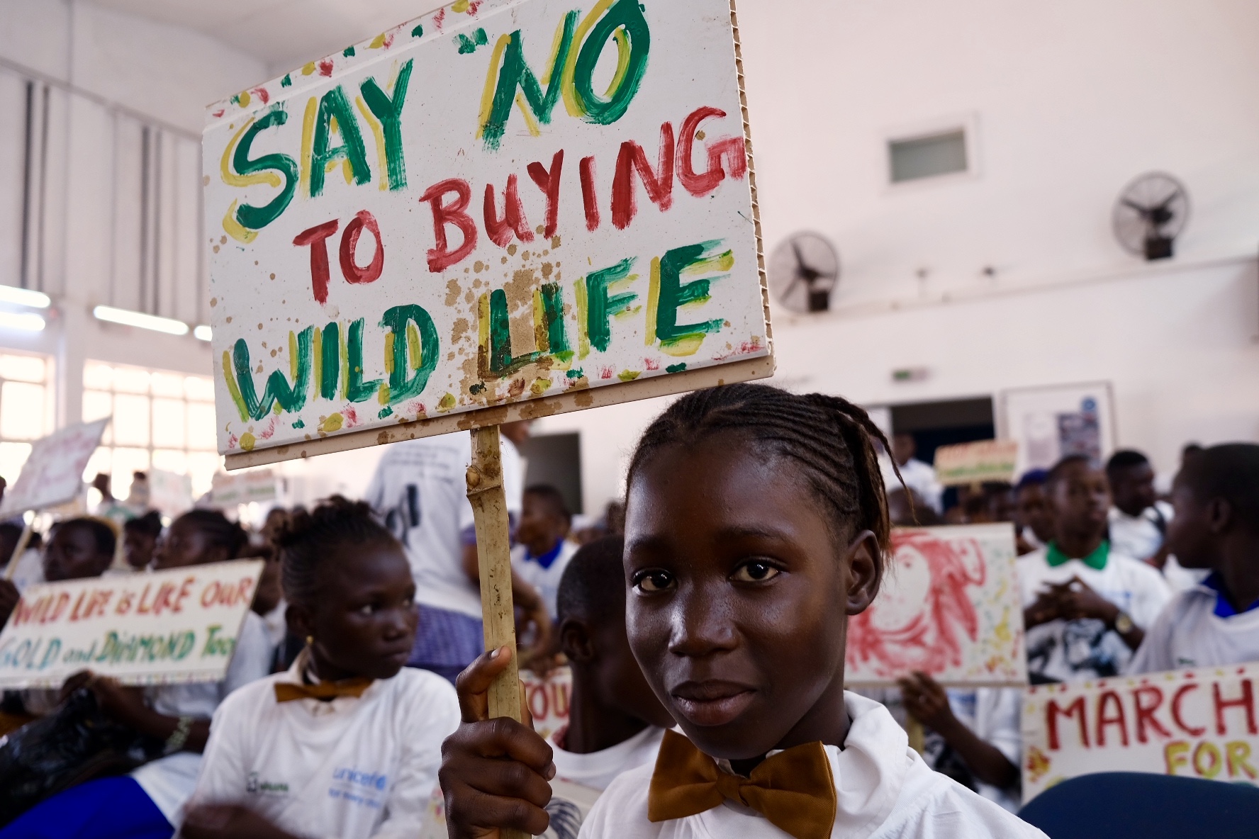 Girl who participated in the climate march with her sign. (Cate Twining-Ward/George Washington University)