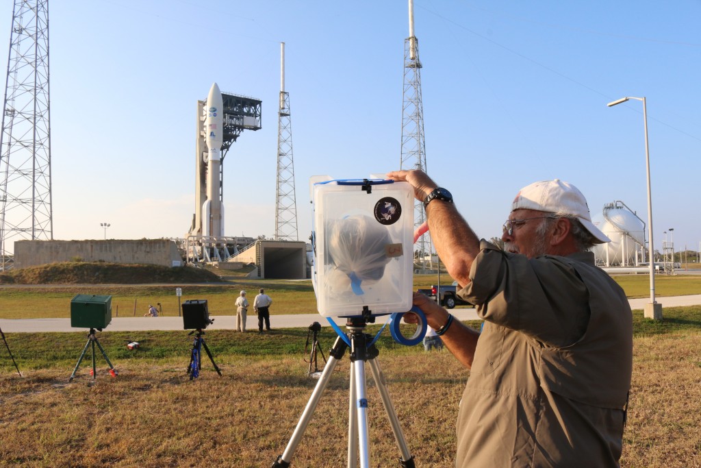 John Studwell, photographer for AmericanSpace, uses masking tape to secure one of his camera rigs. (Kelly Calagna/MEDILL)