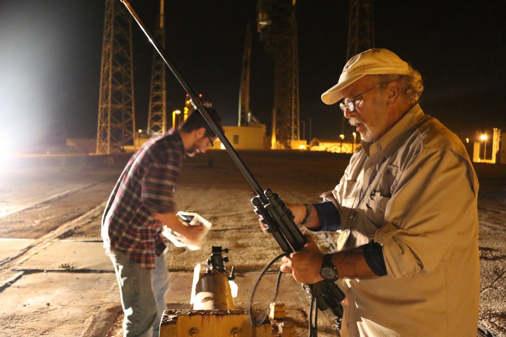 Photographer John Studwell retrieves one of his camera rigs post launch. (Kelly Calagna/MEDILL)