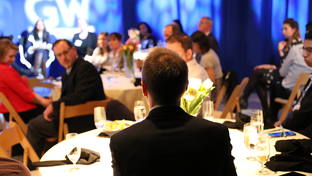 The crowd discusses solutions to the global water crisis.