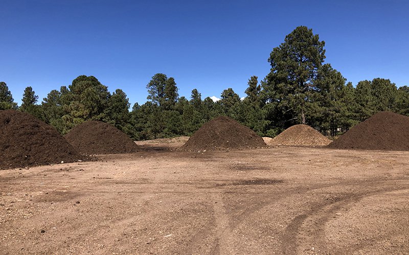 Compost piles are separated by how old each pile is on Northern Arizona University’s campus. The majority of dining hall food waste is used to create these dirt piles.
