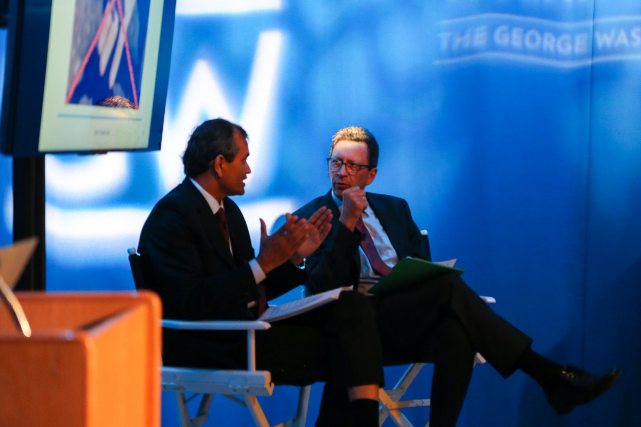 Crickets for dinner? Vimlendra Sharon, UN-FAO, and Frank Sesno, Planet Forward, respond to a question about using insects as a more sustainable form of protein. (Photos by Planet Forward)