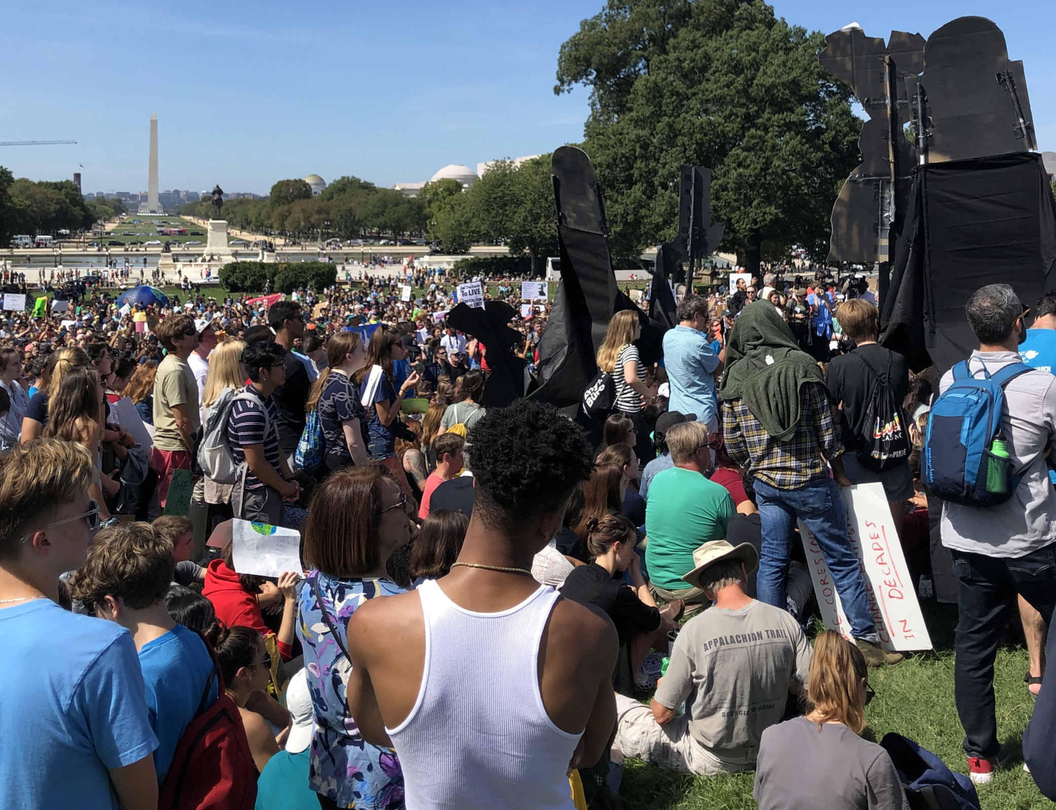 People crowd the mall for the climate protest in front of the Capitol.