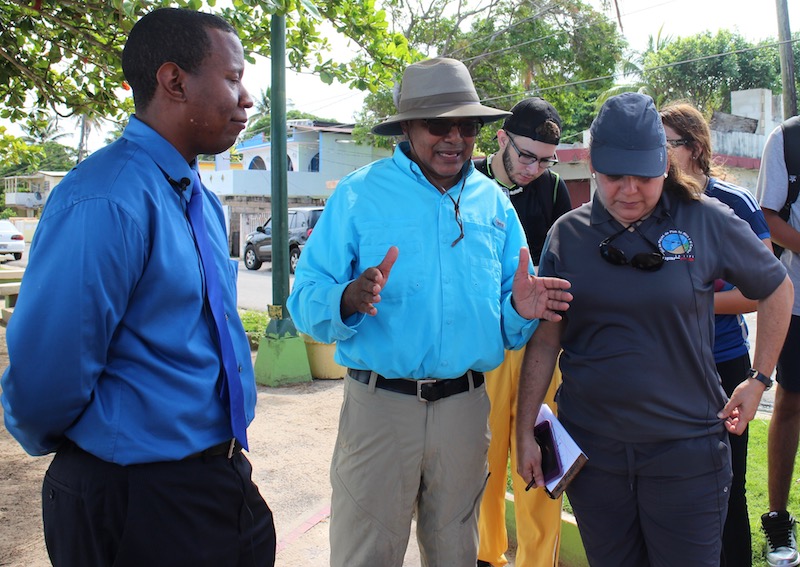 Researchers Rafael Méndez Tejeda (center) and Maritza Barreto (right) are analyzing coastal erosion around Loiza, working with community leader Alexi Correa (left). (Janice Cantieri/MEDILL)