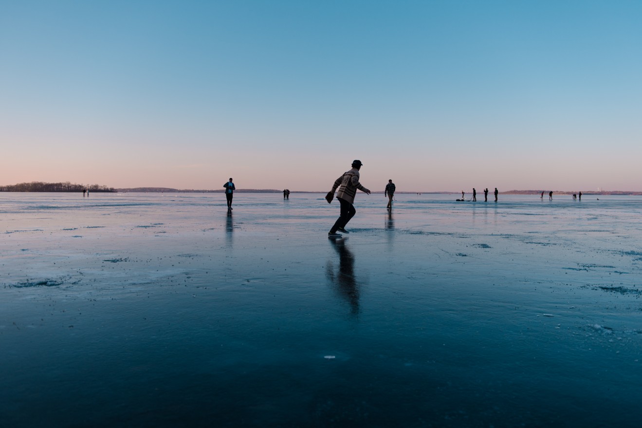 People were playing on the lake.