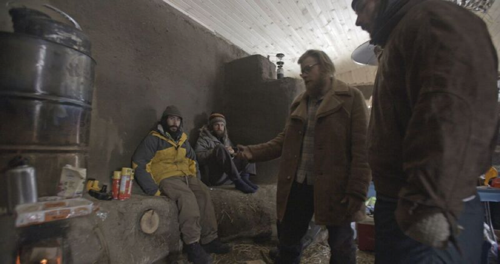 A large cob bench inside the school acts a thermal mass capturing the heat from the rocket heater.