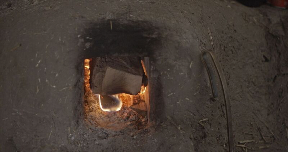The large cob rocket mass heater keeps the building warm in below zero temperatures.