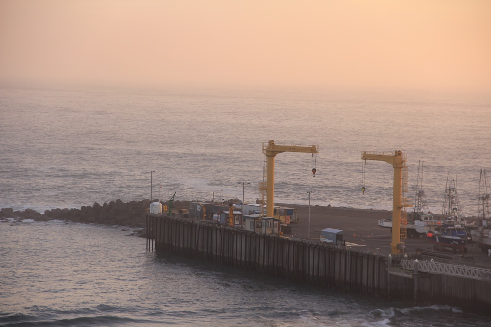 Port Orford&#039;s dock is the only crane-operated dry dock on the West coast. Due to the unprotected geography of the port, boats are hoisted up to the dollies when not out fishing. (Jacob Lebel/Umpqua Community College)