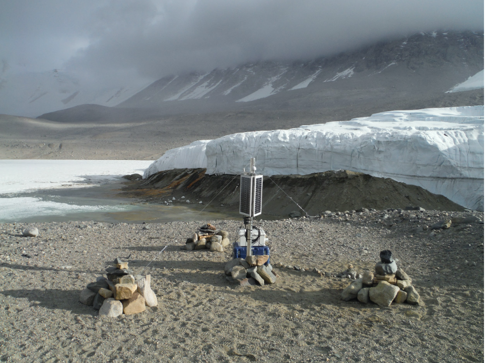 With Blood Falls in the background, one of Carr’s seismometers is buried underground with its power supply anchored aboveground to withstand forceful winds. (Photo courtesy Chris Carr)