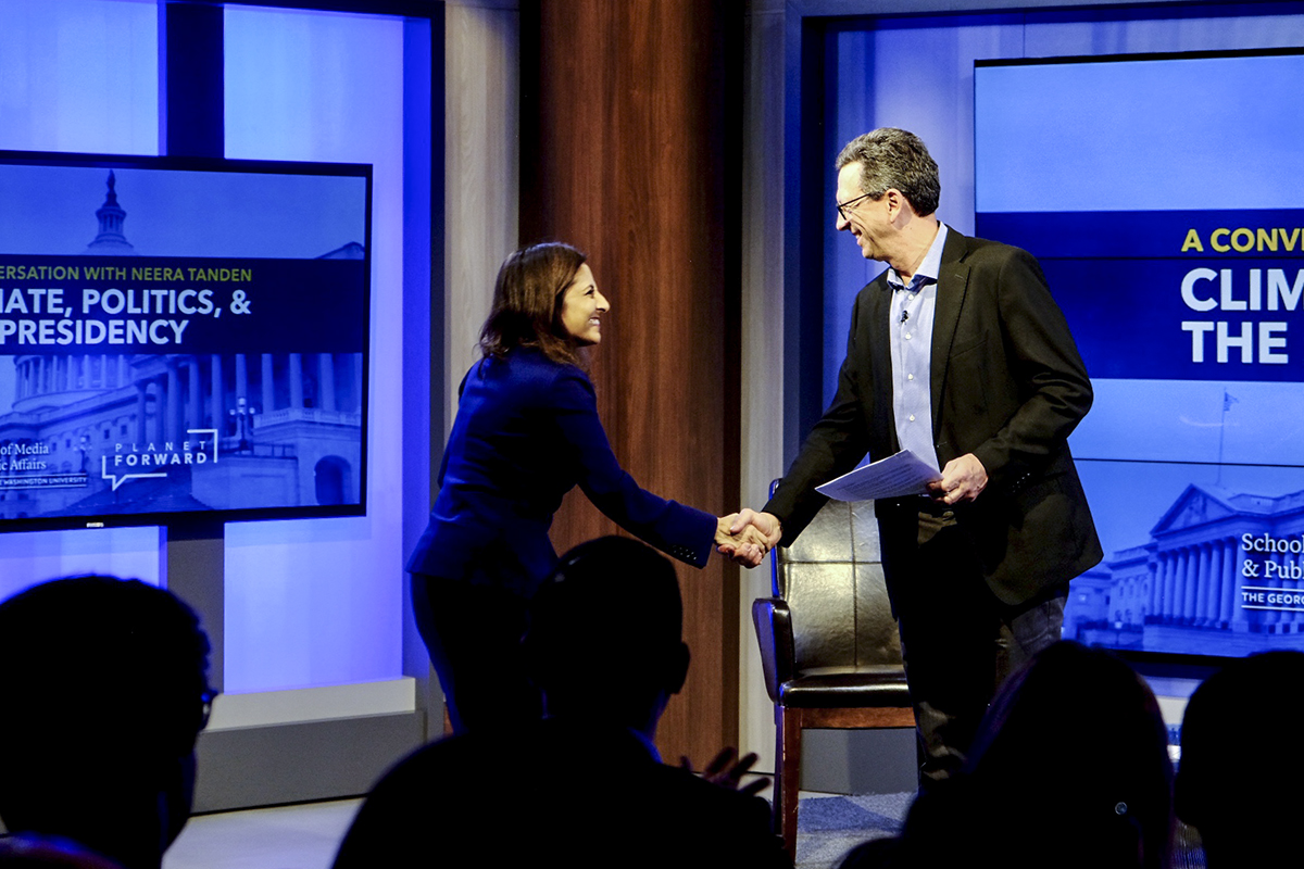 Neera Tanden, president and CEO for the Center for American Progress Action Fund, is welcomed to the stage by Frank Sesno. (Dan Reed/Planet Forward)