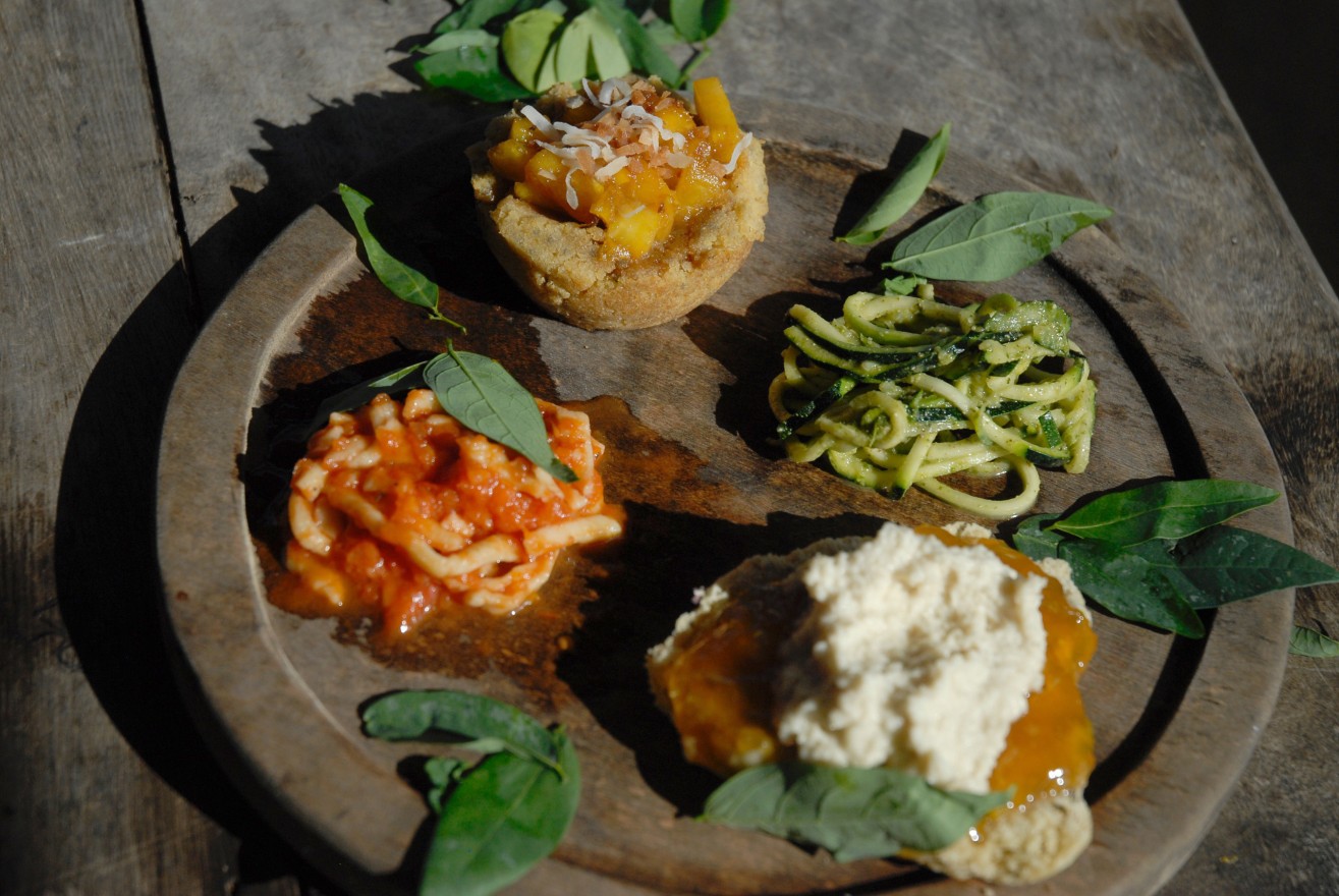 A plate showcases the products from a cooking class put on by culinary interns. The homemade pasta, pineapple cornbread, zucchini noodles, and scone all featured ingredients from within Kalu Yala, but they also required many ingredients from local growers outside of the town.