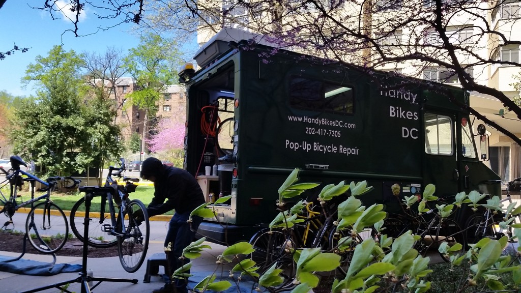 Handy Bikes DC hard at work repairing a bicycle. (Photo courtesy of Peter Buck, Handybikes DC)