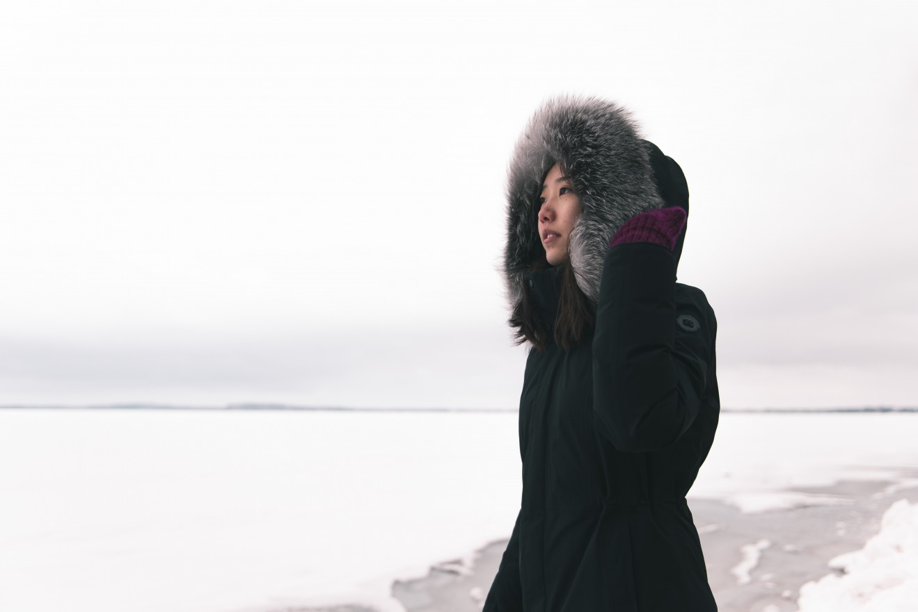 It was another snowy day after a week of warming. In this photo the surface of the lake was completely melted and while this girl in the picture trying to walk on to the seemingly tranquil lake, the water stopped her from stepping further.