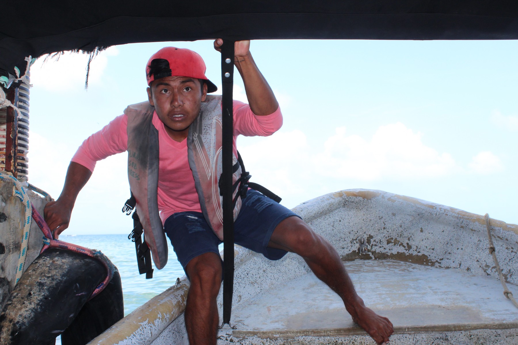 tourism in action - sailor steers boats full of tourists