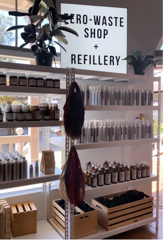 A shelf of bottles at a zero-waste shop and refillery